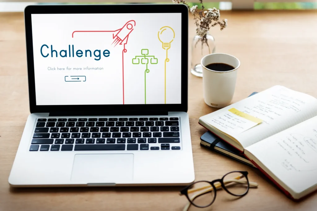 Laptop with a presentation on 'Challenge' symbolizing the strategic hurdles and solutions for CFOs, as explored by JOH Partners.