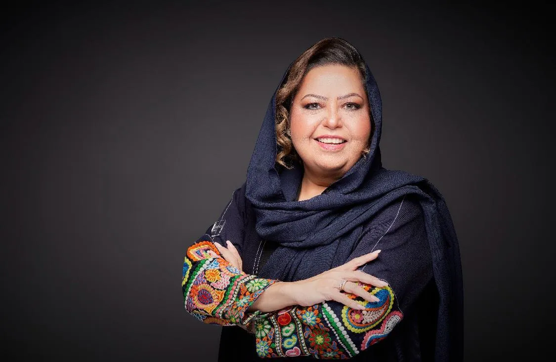 Portrait of Magdalen Boukhary, featured in a JOH Partners podcast on leadership and data utilization. She is smiling, dressed in a dark hijab with a colorful embroidered sleeve, symbolizing her vibrant approach to data-driven leadership.